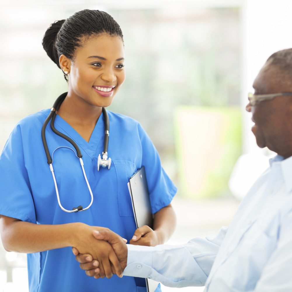 african american medical nurse handshaking with senior patient